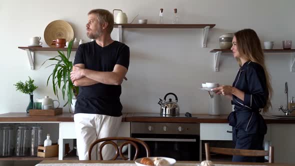 Cheerful Wife Is Bringing Coffee for Spouse, Man Is Rejoicing, Breakfast of Loving Married Couple