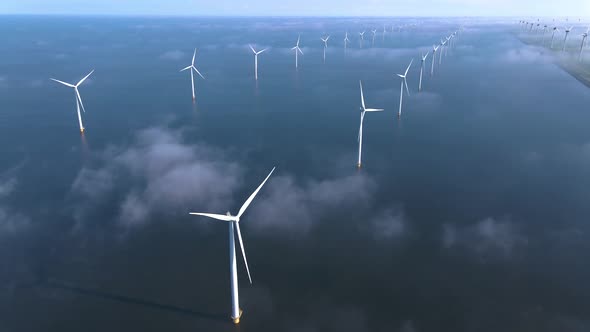 Wind Turbines in the Early Morning Wind Mill Park in the Netherlands