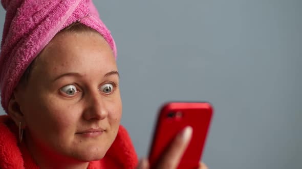 Surprised girl look at smartphone