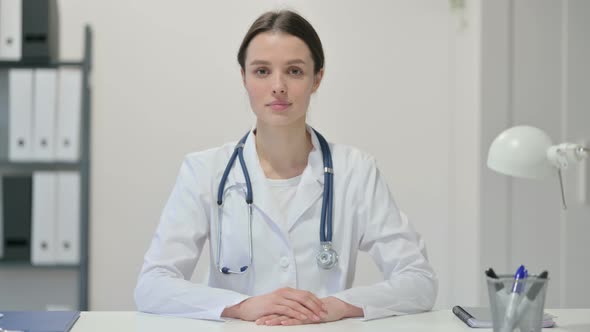 Serious Female Doctor Looking at the Camera 