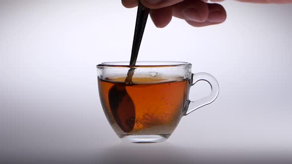 Sugar Stir in a Cup with Tea of a Spoon