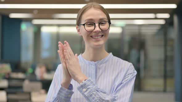 Portrait of Happy Young Woman Clapping Applauding