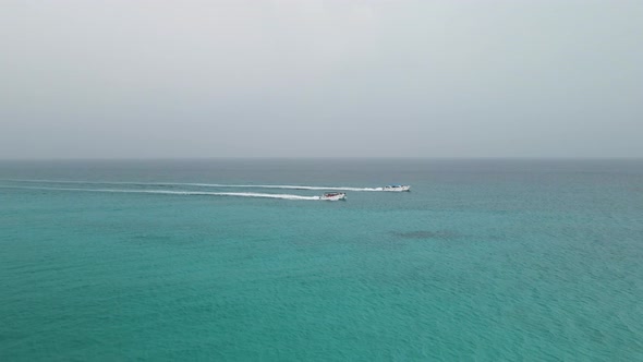 Two Tourist Boats Sail On The Sea