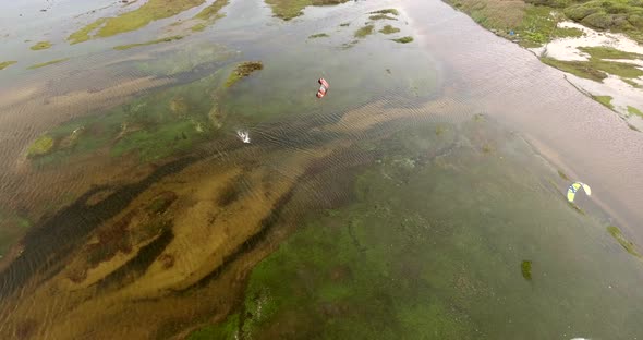 Aerial view of people kitesurfing on caiupe Lagoon, Brazil.