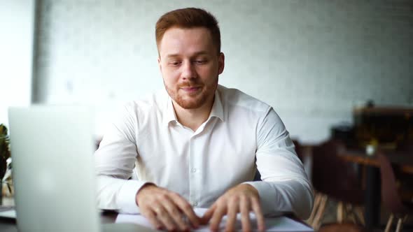 Close-up Portrait of Young Business Man Explaining To Partner Benefits of New Deal To Colleague.