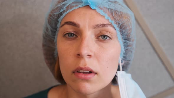 Portrait Female Doctor or Nurse in Uniform Feeling Down