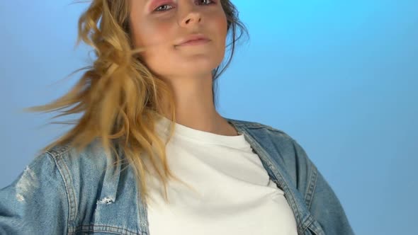 Smiling Lady on Blue Background, Model Posing for Fashion Shooting, Slow-Motion