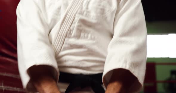 Man practicing karate in fitness studio