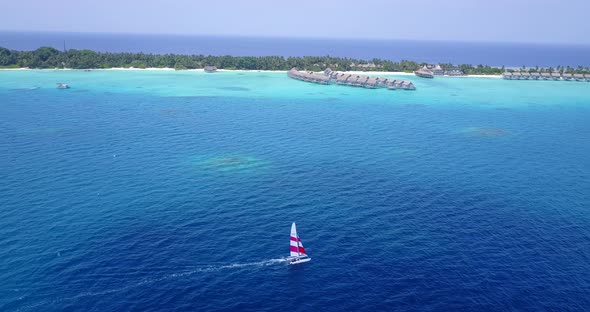 Wide angle aerial abstract view of a white sandy paradise beach and blue sea background in high reso