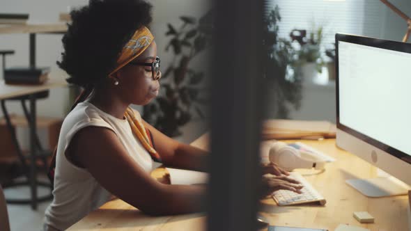 Portrait of Positive Afro-American Businesswoman at Work in Office