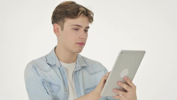 Young Man Using Digital Tablet on White Background