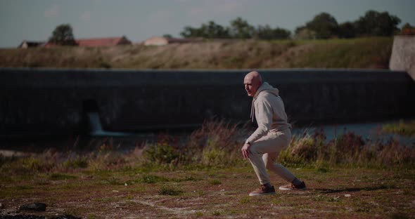 Senior Man Doing Gymnastics Outdoors