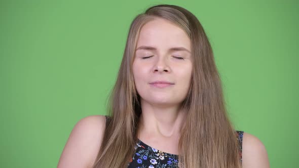 Young Happy Beautiful Woman Relaxing with Eyes Closed