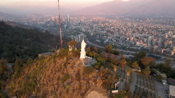 Aerial pan left of statue in Sanctuary of the Immaculate Conception in San Cristobal Hill summit, Sa