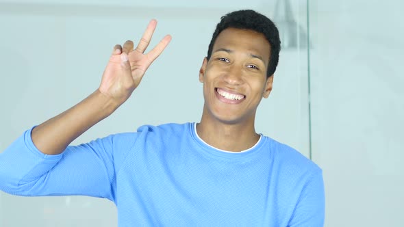 Victory Sign by Successful Young Afro-American Man