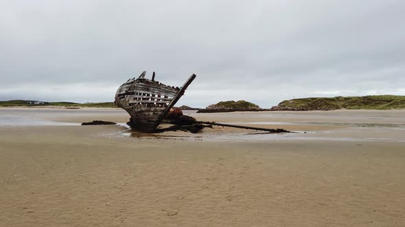 Shipwreck Called Bad Eddie in the Rain in County Donegal Ireland  Translation  Boat Eddie
