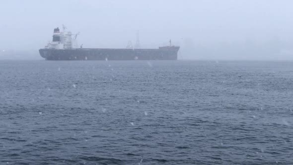 Cargo Ship In Snow Fall