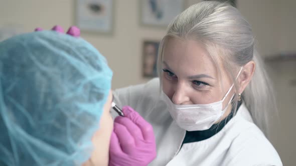 Cosmetologist Applies Permanent Tattooing on Girl Brows