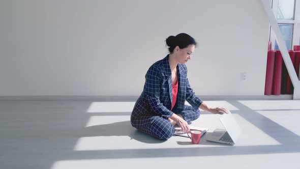 Business and Healthy Lifestyle Concept. Portrait of Young Office Woman Sitting Cross-legged in Half