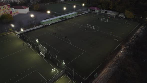 Soccer Training on Playing Field at Night Aerial View