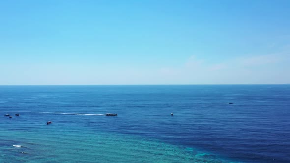 Aerial drone view landscape of marine coast beach wildlife by blue water and white sand background o