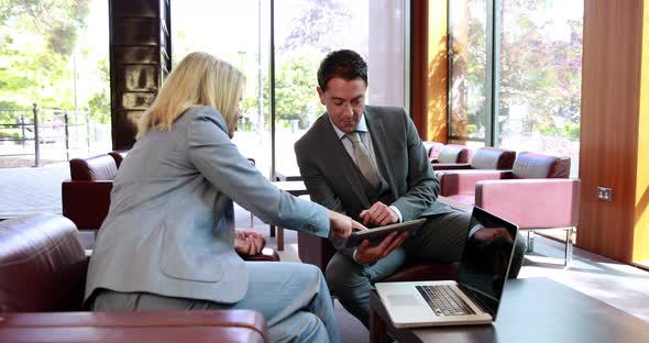 Business People Using Digital Tablet in Meeting