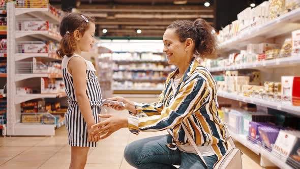 Happy Girl Rejoices at Unexpected Purchase Favorite Treat