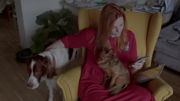 Woman with Dogs Resting at Home