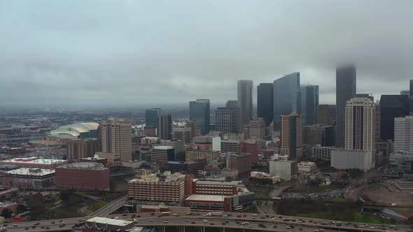 This video is about an aerial view of downtown Houston on  a gloomy and rainy day. This video was fi