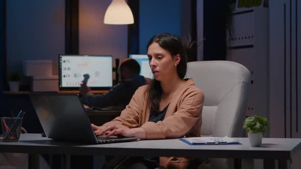 Joyful Successful Businesswoman Enjoying While Looking at Laptop Computer