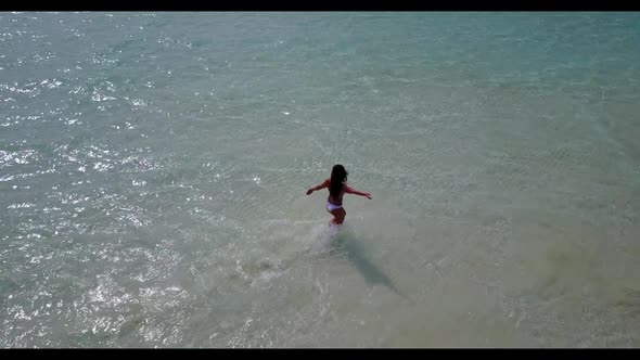 Tourist tanning on luxury island beach time by blue lagoon with white sand background of the Maldive