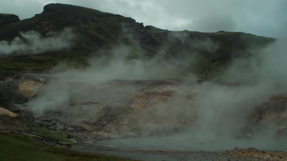 iceland landscape, geothermal hot spring pool steam smoke,
