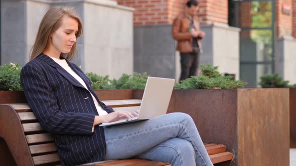 Woman with Headache Using Laptop Sitting Outside Office Pain in Head