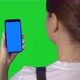 Woman Builder in Blue Overalls Hold Mobile Phone with Green Screen - VideoHive Item for Sale