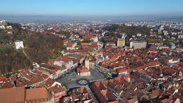 Aerial drone view of The Council Square in Brasov, Romania. Old city centre with County Museum of Hi