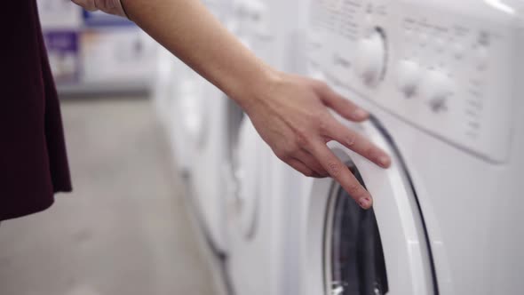Choosing Washing Mashine in Appliance Store