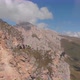 Aerial Shot of a Group of Climbers on Top of a Mountain Pulling a Rope. - VideoHive Item for Sale