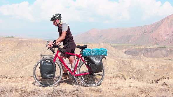 Cyclist Push Touring Bicycle In Mountains (2)