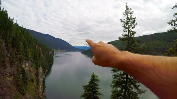 Hiker pointing at distance 4k