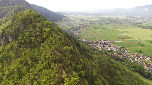 Flying over mountains and hills on a beautiful spring morning