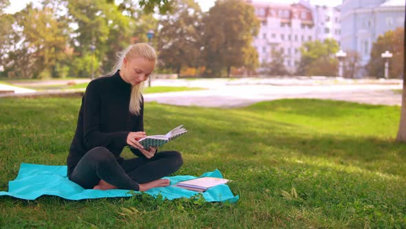 Caucasian Girl with Studying Outdoors