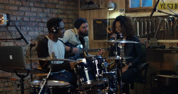 Young Musicians Rehearsing in Garage