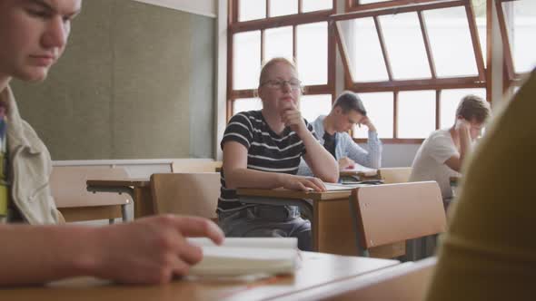 Caucasian girl thoughtful in class