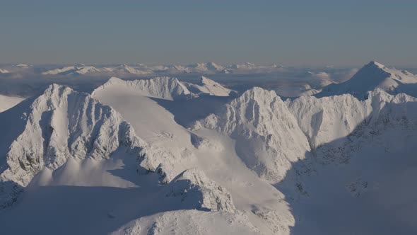 Aerial Panoramic View of Canadian Mountain Covered in Snow