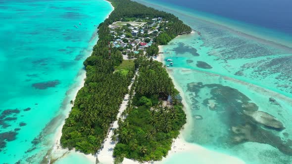 Aerial top down travel of tranquil lagoon beach journey by blue ocean and white sandy background of 