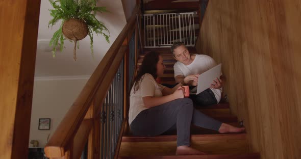 Couple at home together on the stairs 4k