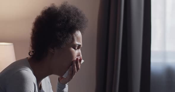 Black Female Coughing in Morning