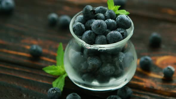 Jug Full of Blueberry with Green Leaf