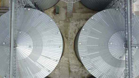 Container for storage of crop. Big group of grain dryers complex for drying grain