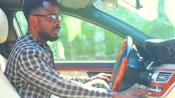 Brazilian Handsome Man Useing Smartphone App to Drive a New Travel Road